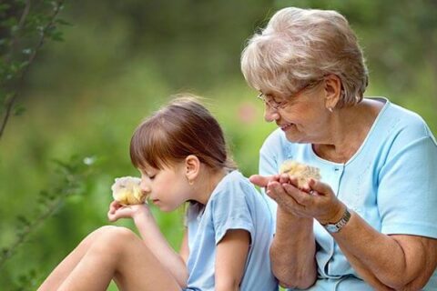 grandmother and granddaughter outside